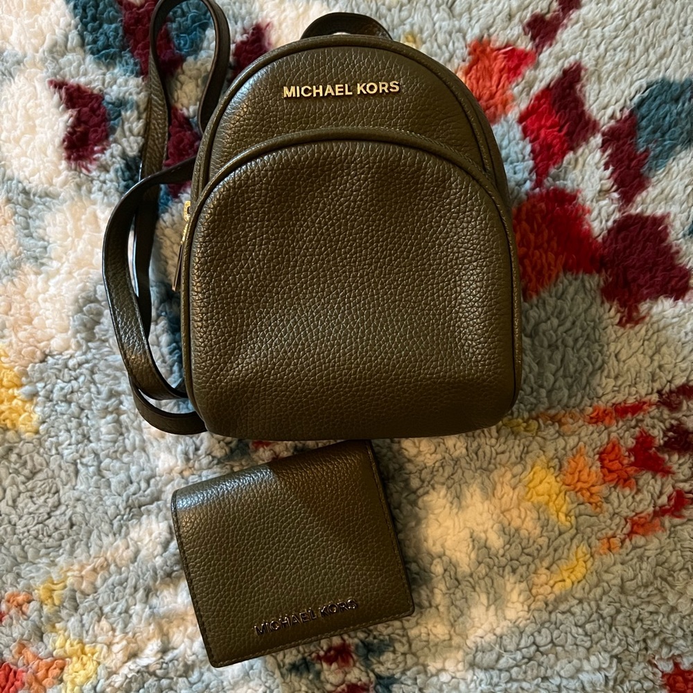 Olive green mini Michael Kors backpack ONLY (wallet not included).